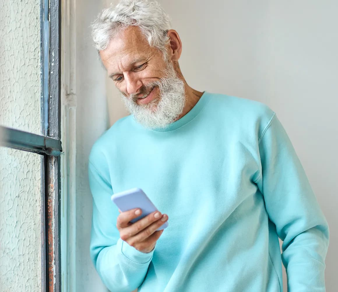 A property owner reviewing information on a phone