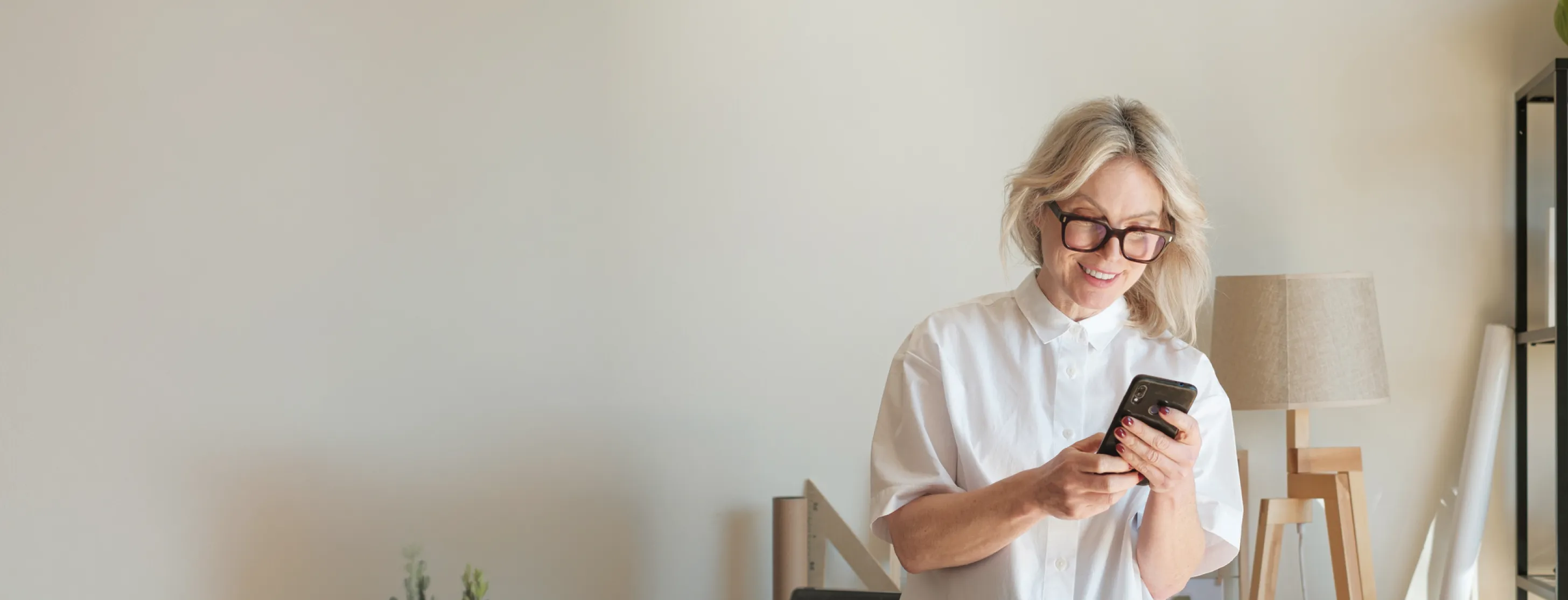 A woman using her phone at home